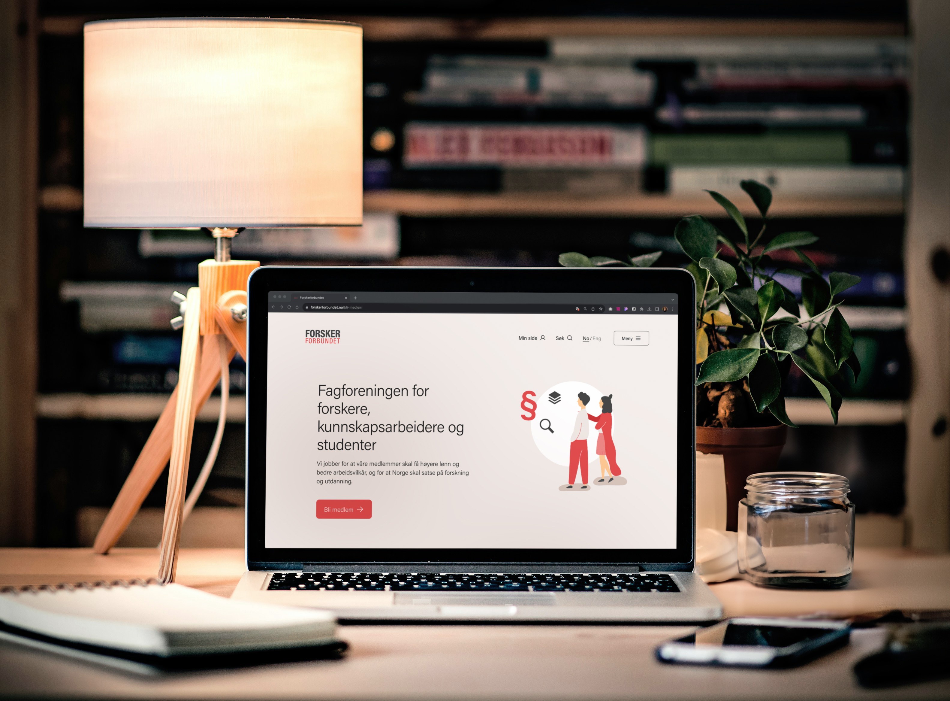 Mockup av en laptop som viser Forskerforbundets nettsider