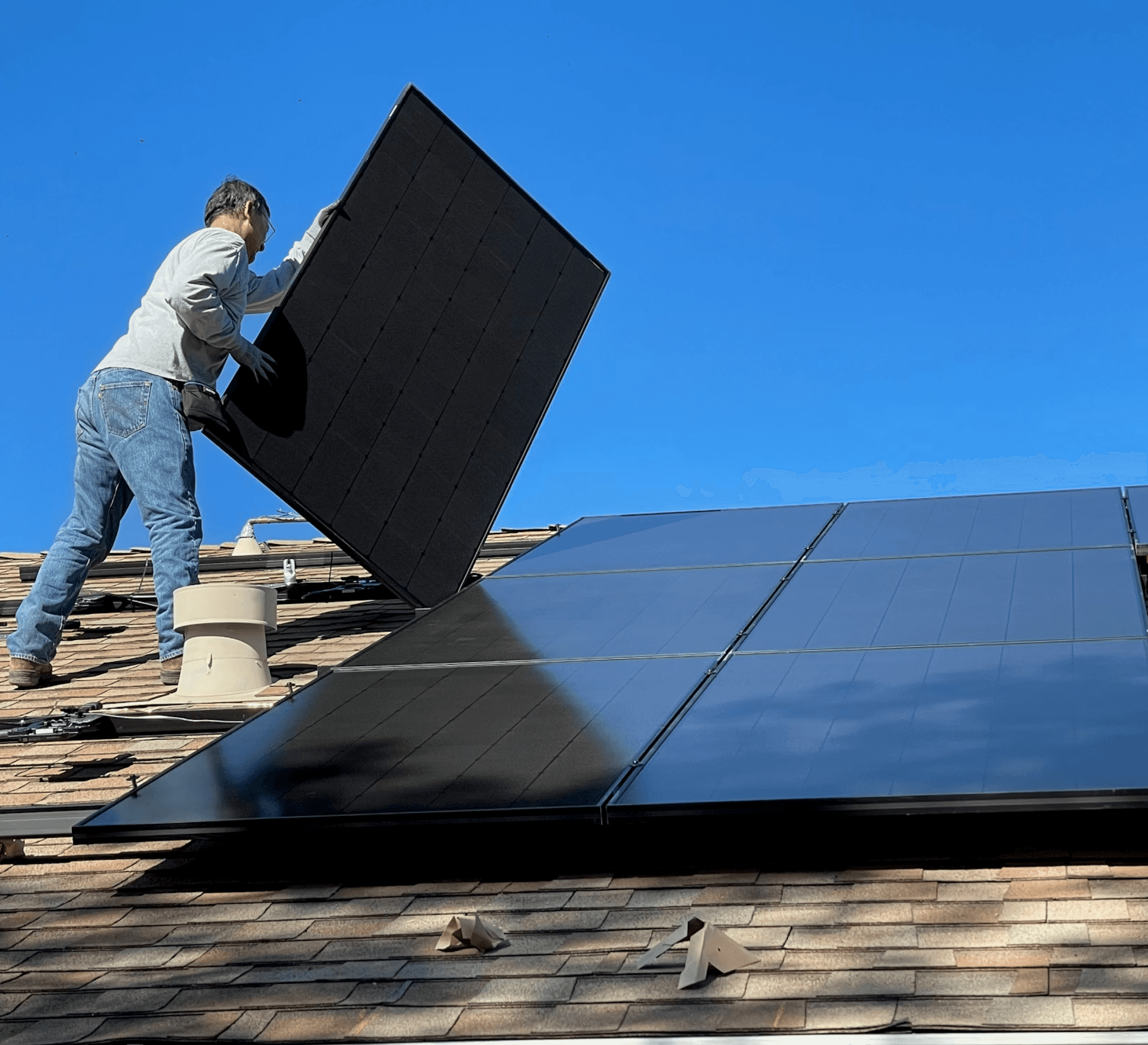 Golden retriever dog sitting near solar panels and camper