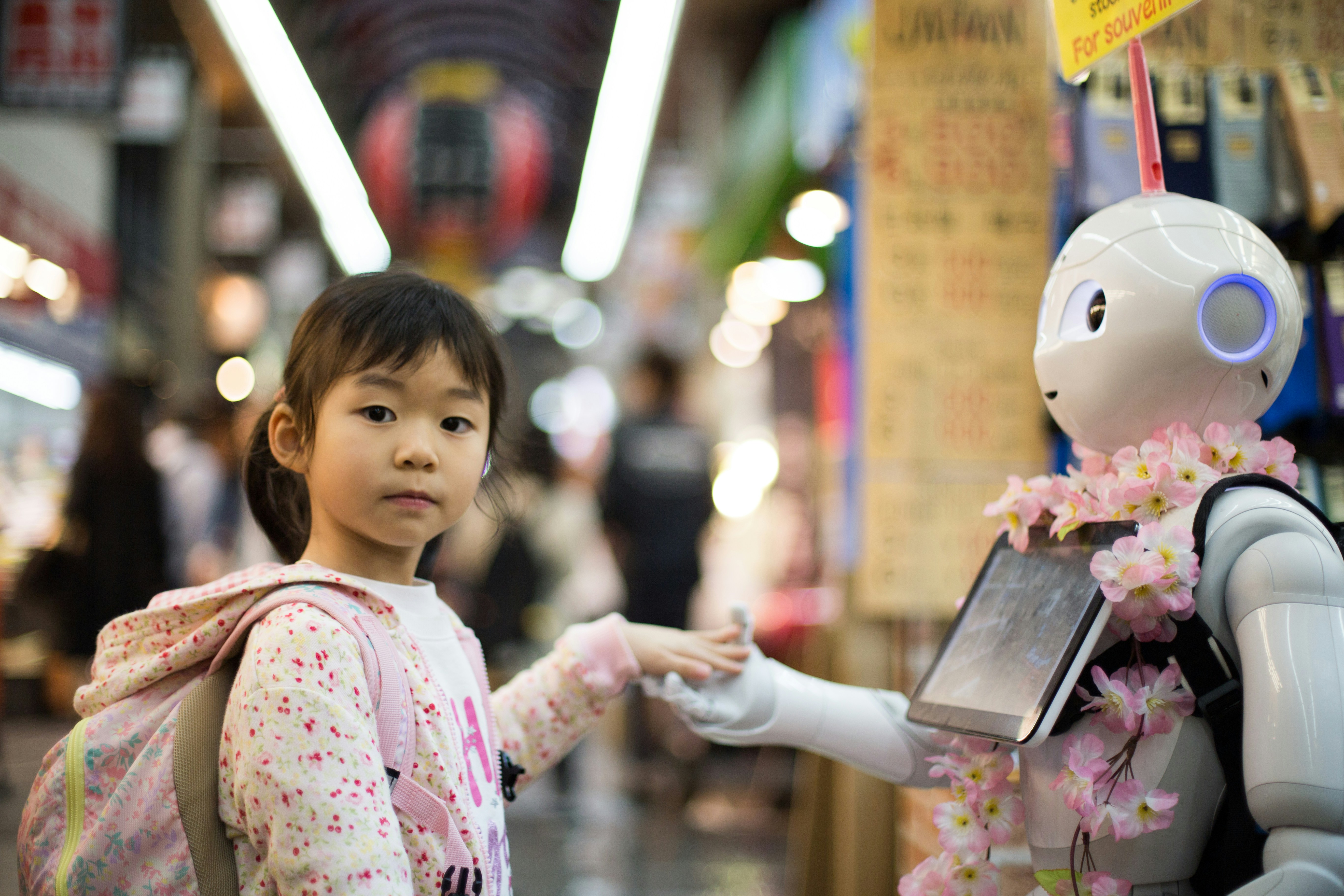 Child interacting with a Robot- What Can AI Help Me With