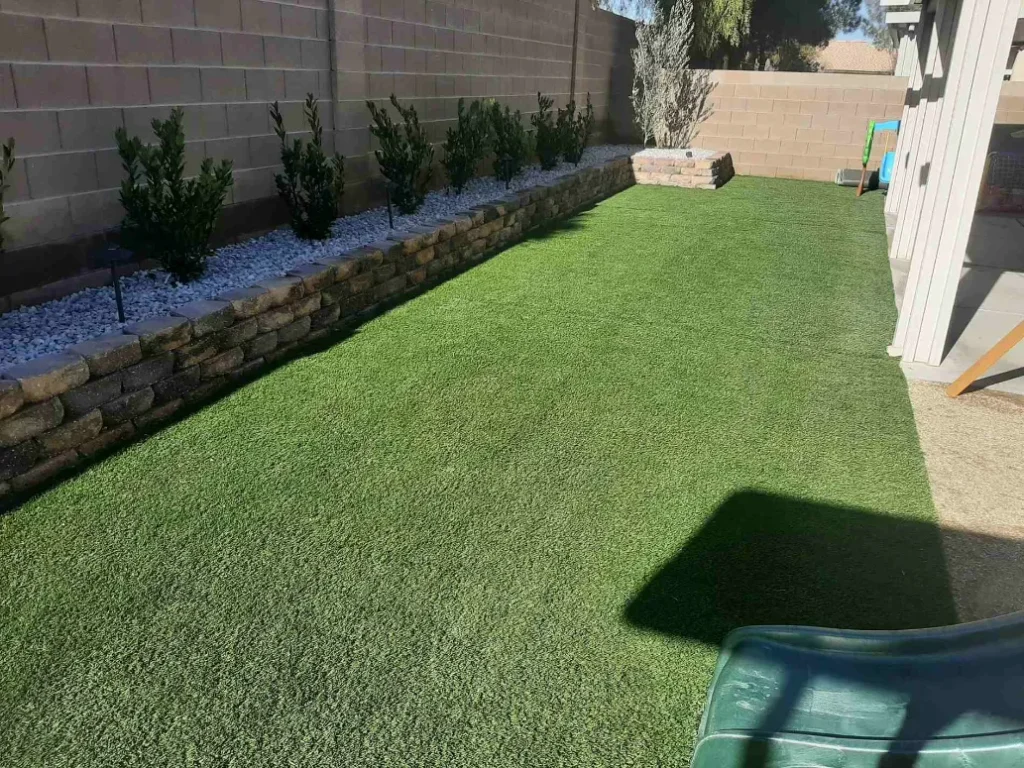 FreshStart Landscaping Vegas artificial turf lawn installation with desert landscaping