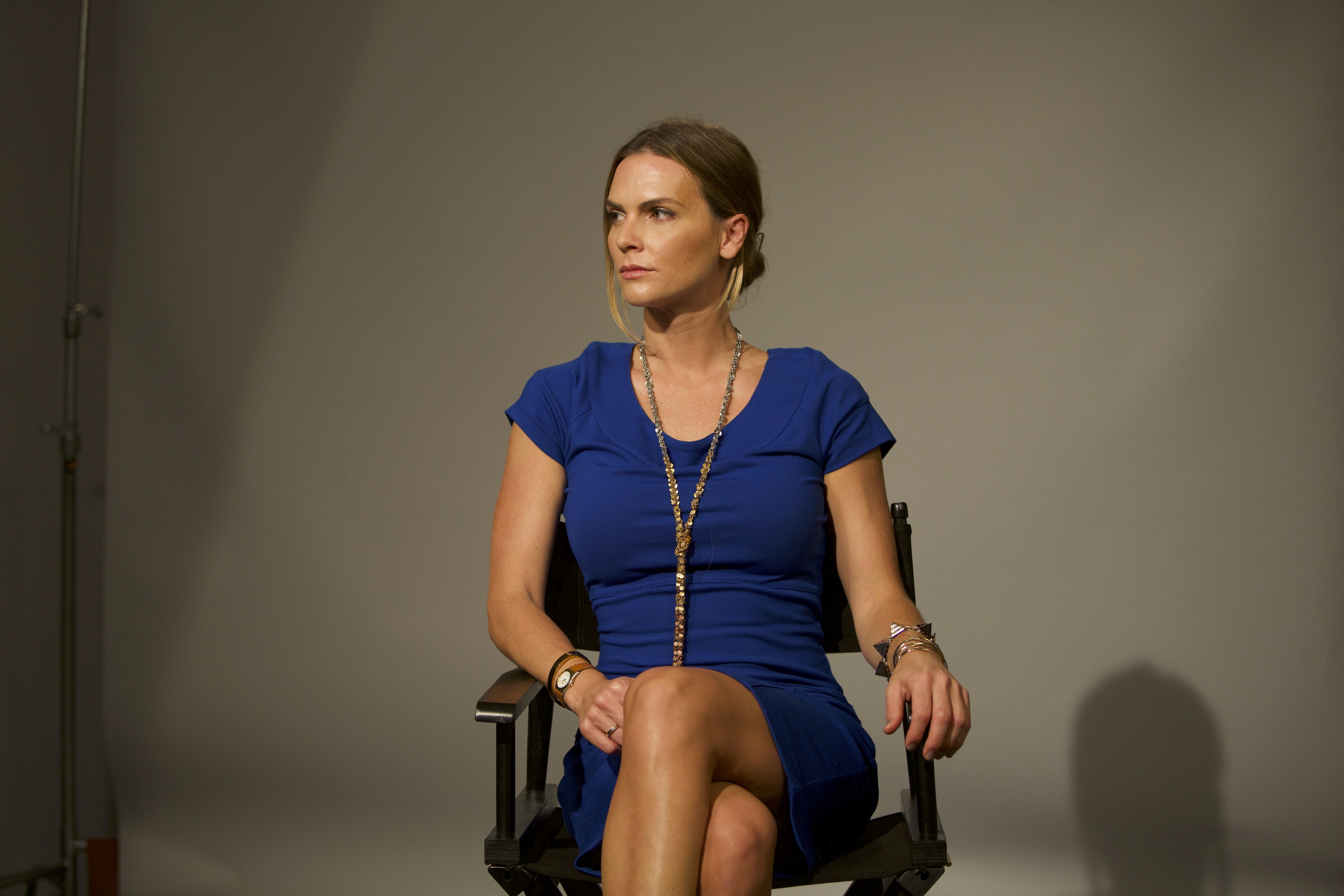 Fashion photoshoot with a woman posing in a dress