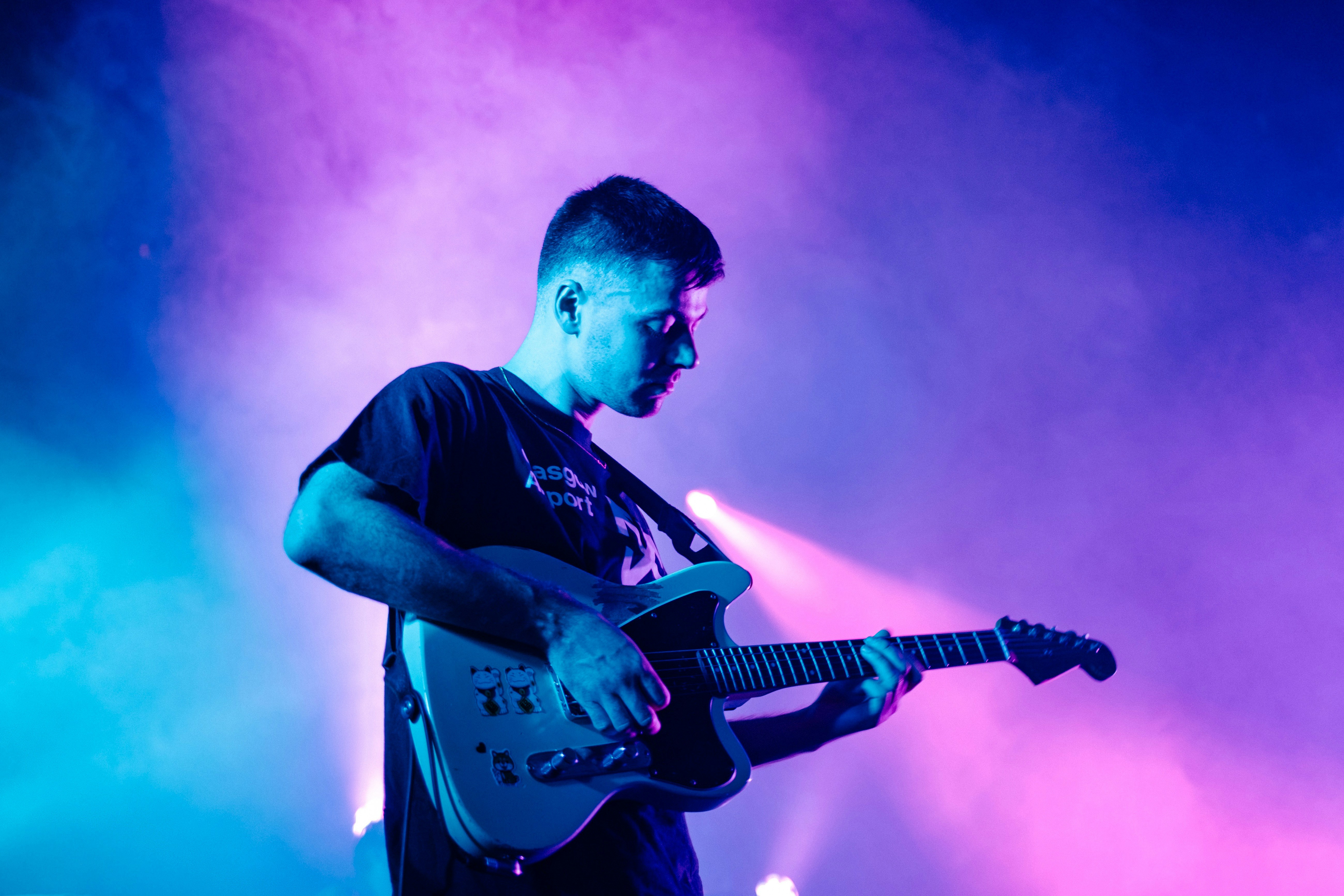 Man playing guitar at a concert