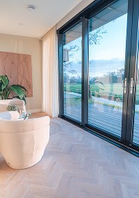 classy afternoon tea setup with macarons, roses and tea