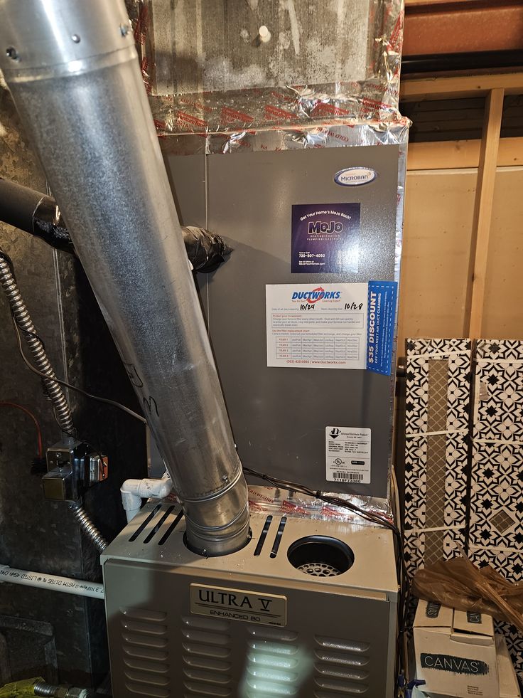 The image displays a service vehicle for MoJo Home Services, an HVAC company operating in the Denver Metro area