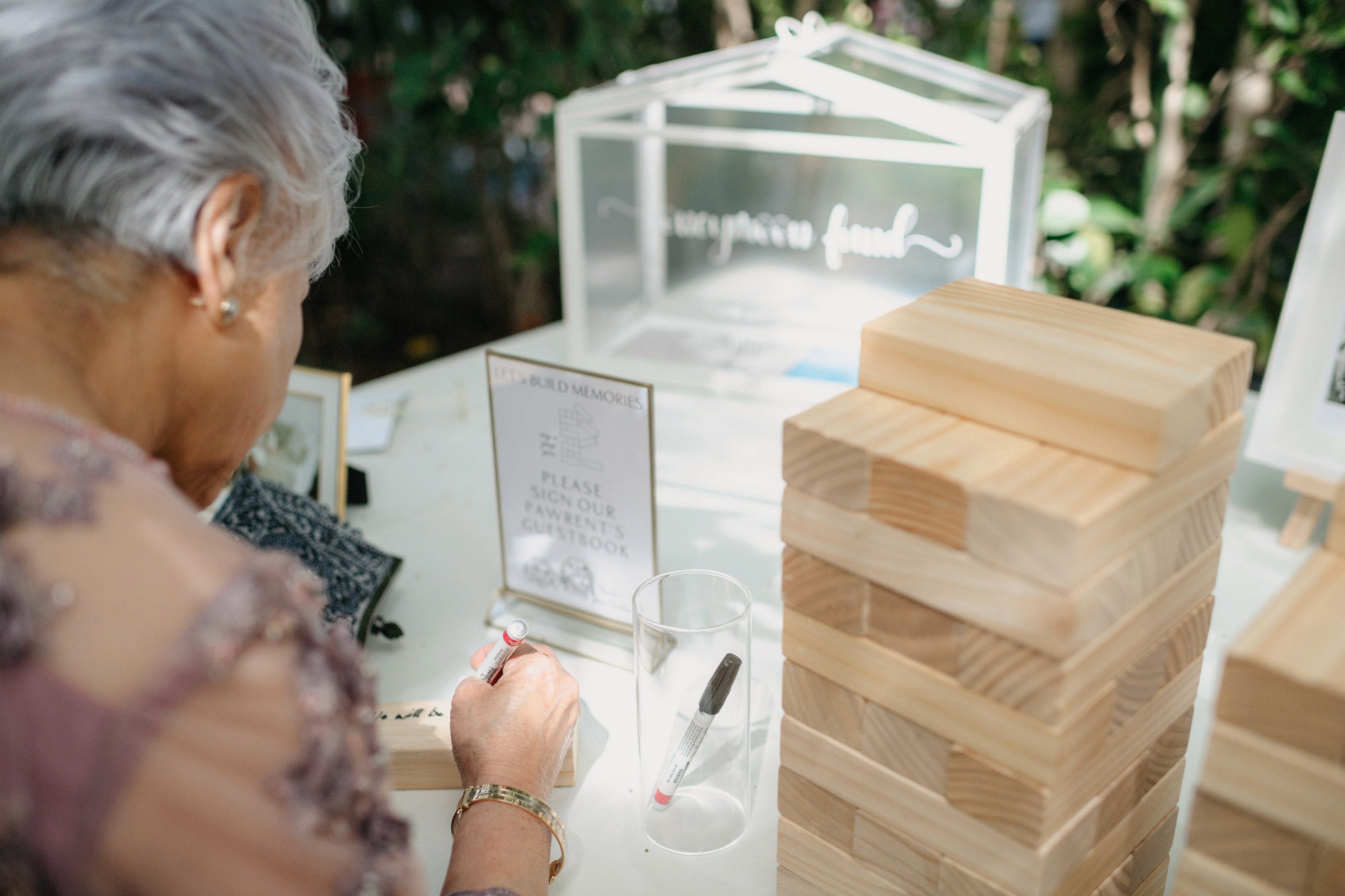 Flat lay wedding details with bouquet, rings, and sparkling bridal heels