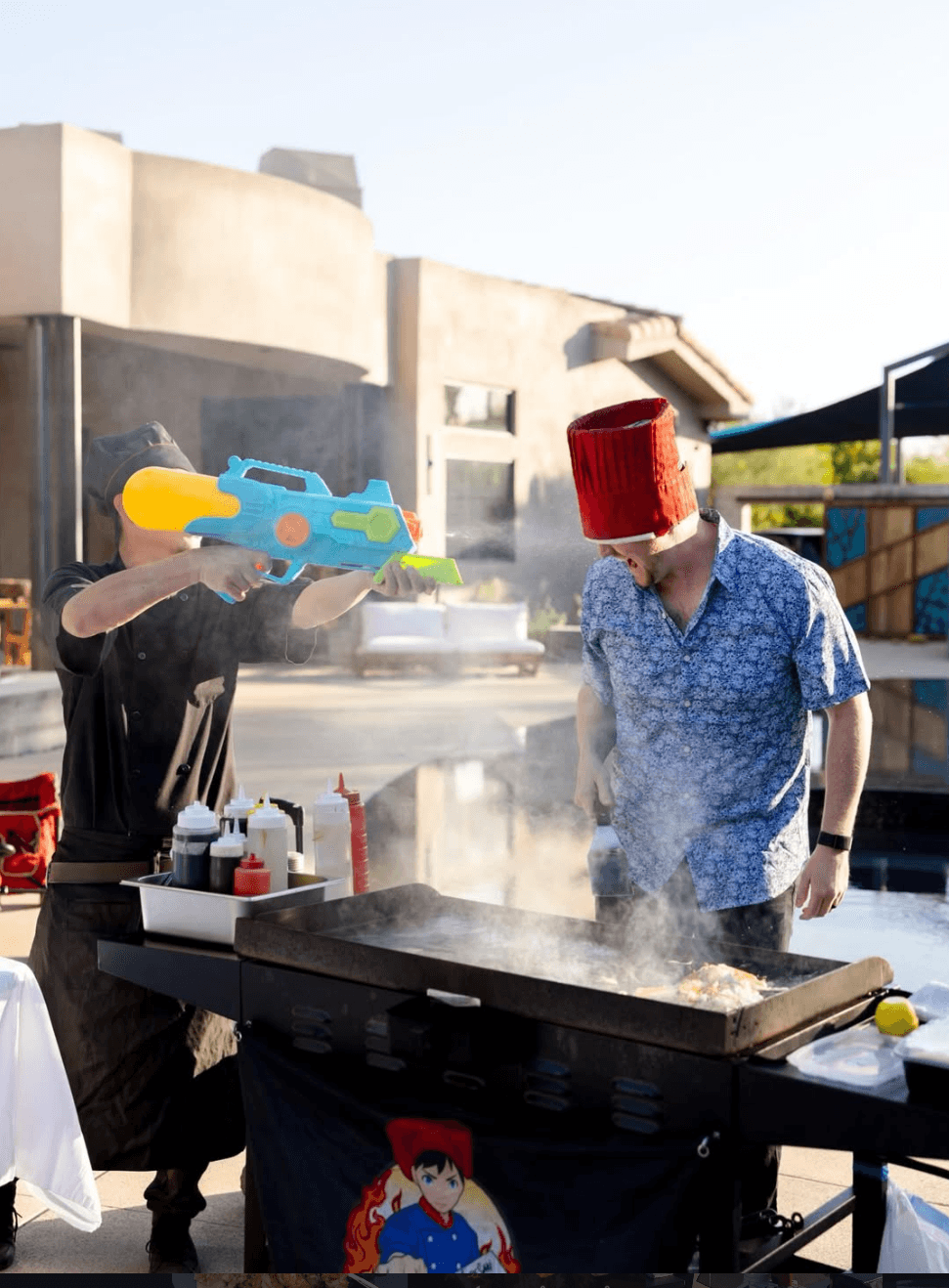 A beautifully arranged table with various dishes, including fruits, bread, and wine, set for a meal.