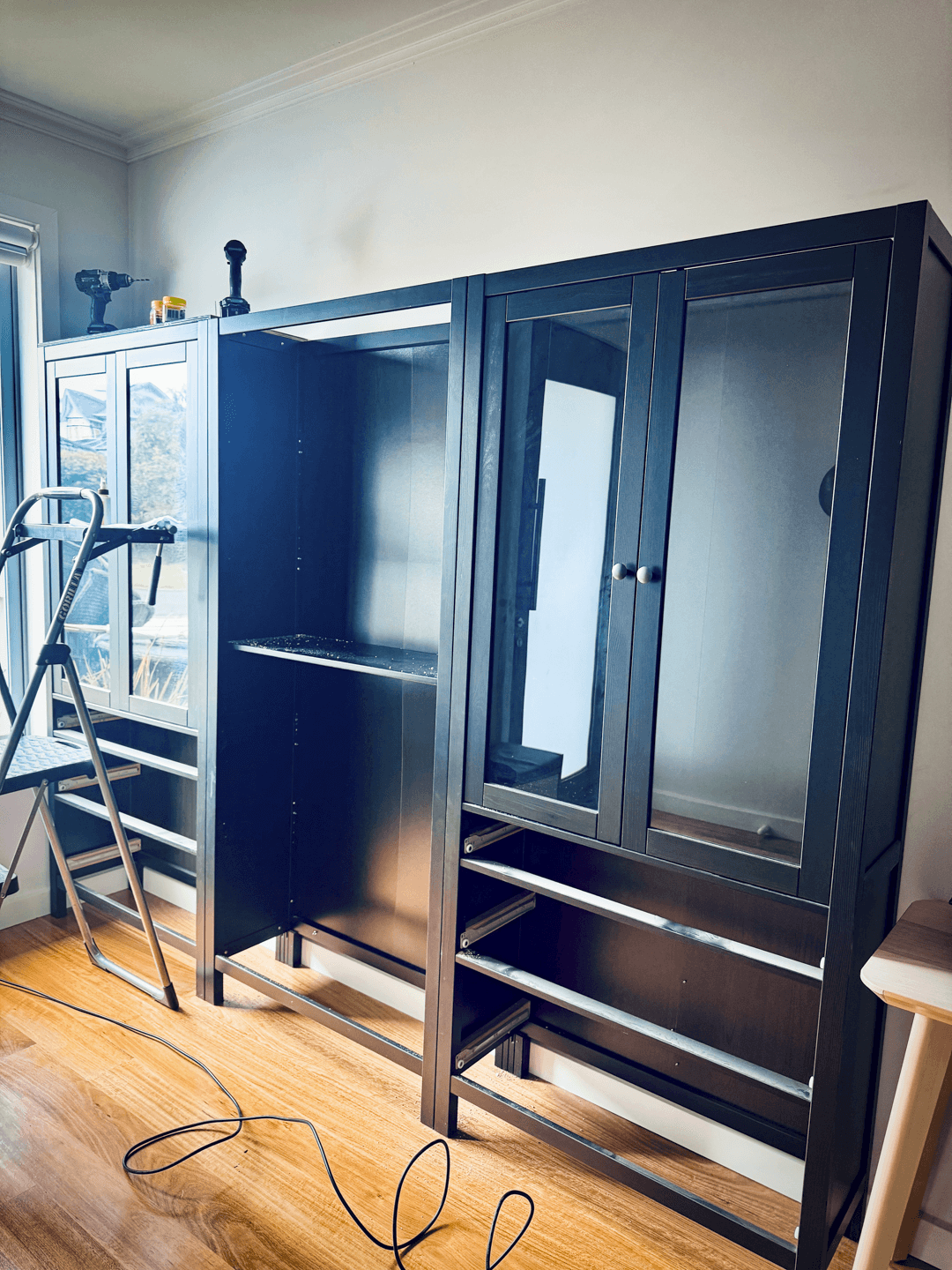 Bookcases lined against the wall with original Hemnes top removed