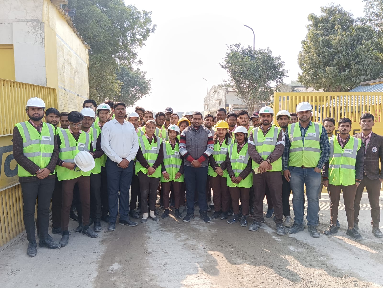 people sitting on chair in front of table while holding pens during daytime
