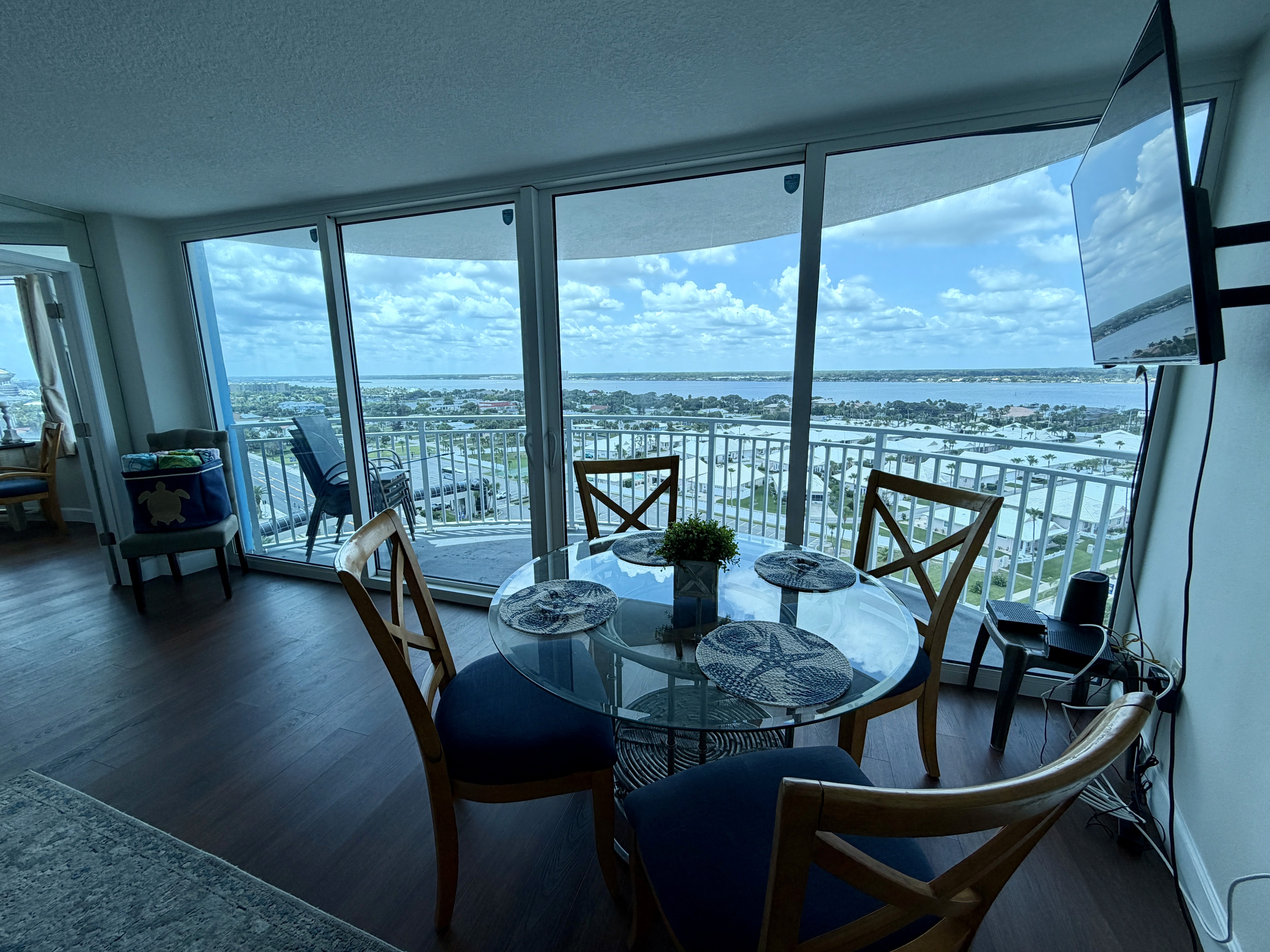 Dining table by windows overlooking the river, Unit 14SW at Peck Plaza, a vacation rental in Daytona Beach Shores