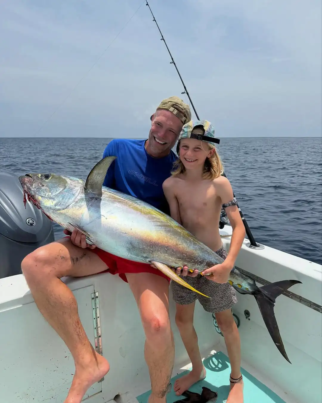 a large stone sculpture with Great Sphinx of Giza in the background