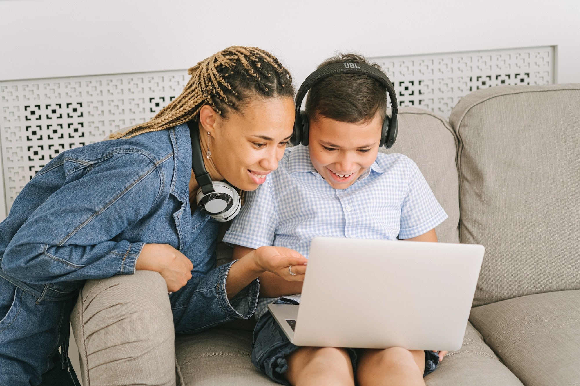 woman and boy using a computer