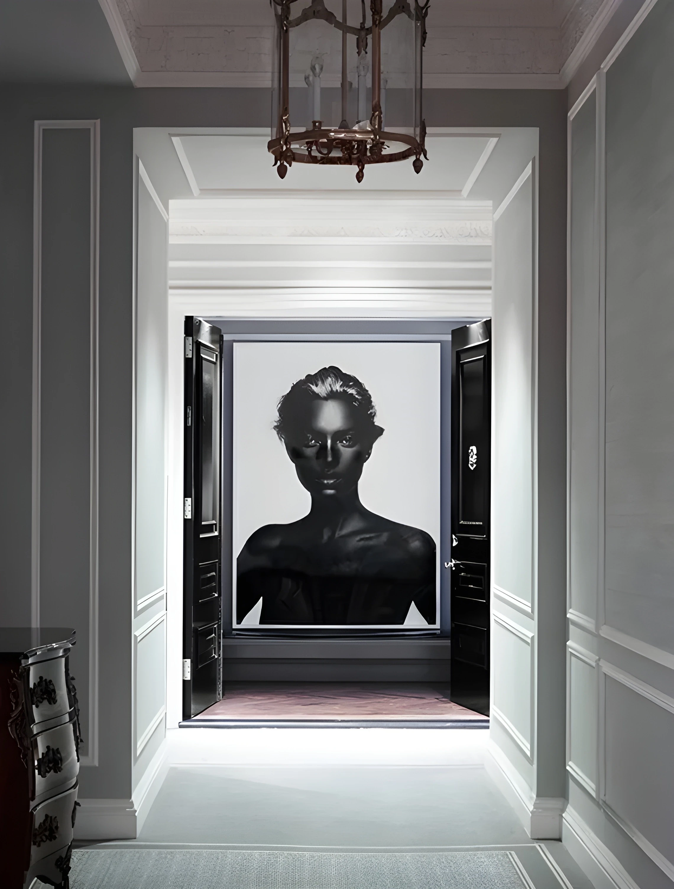 Nick Knight, Kate, inside St. Regis New York owner's suite. Monochrome portrait viewed through an architectural hallway.