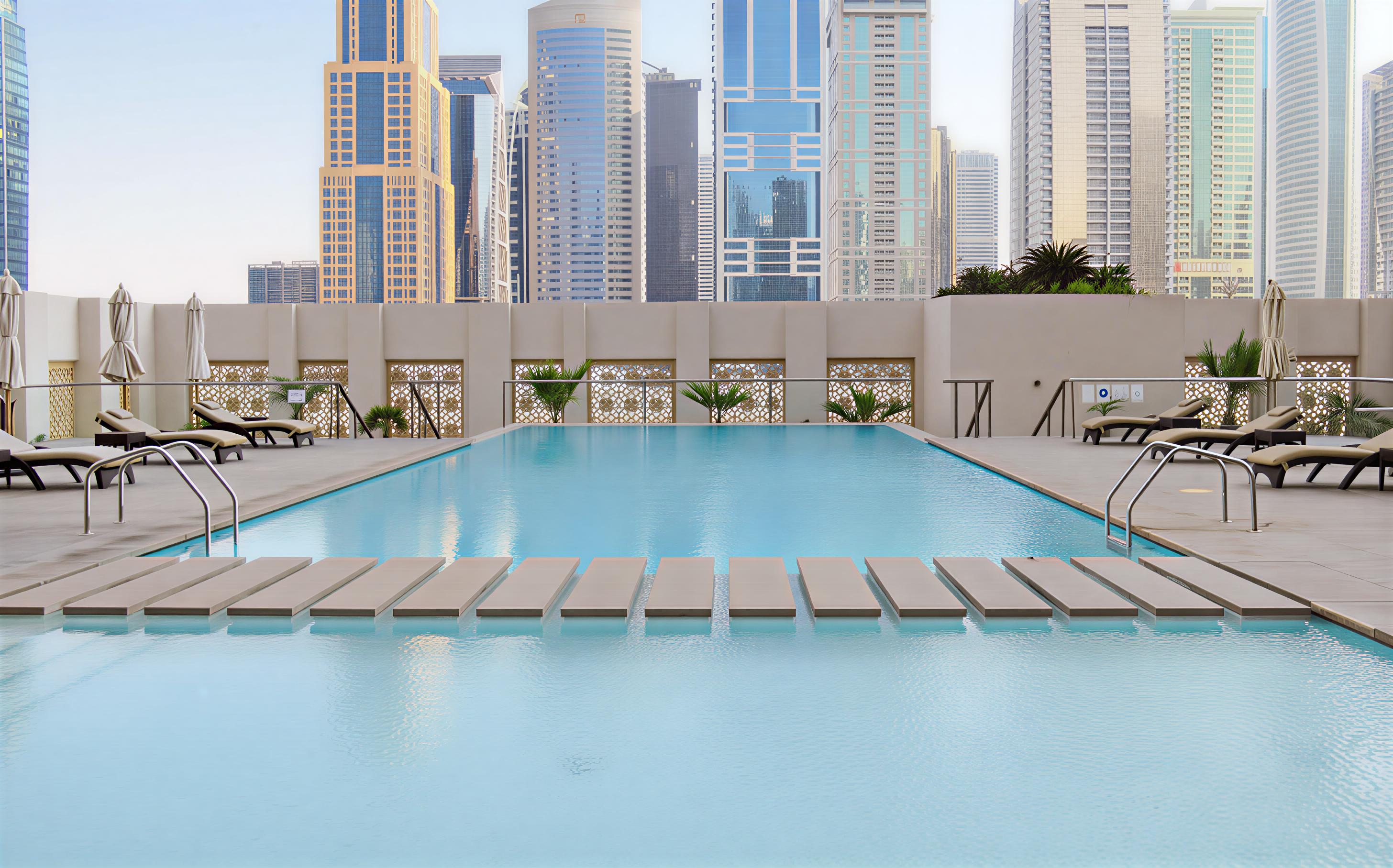 The West Avenue Tower rises in the center of Dubai, representing the city's ongoing development and architectural innovation.