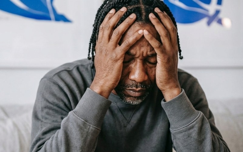 Man reflecting under pressure during a moment of mental strain