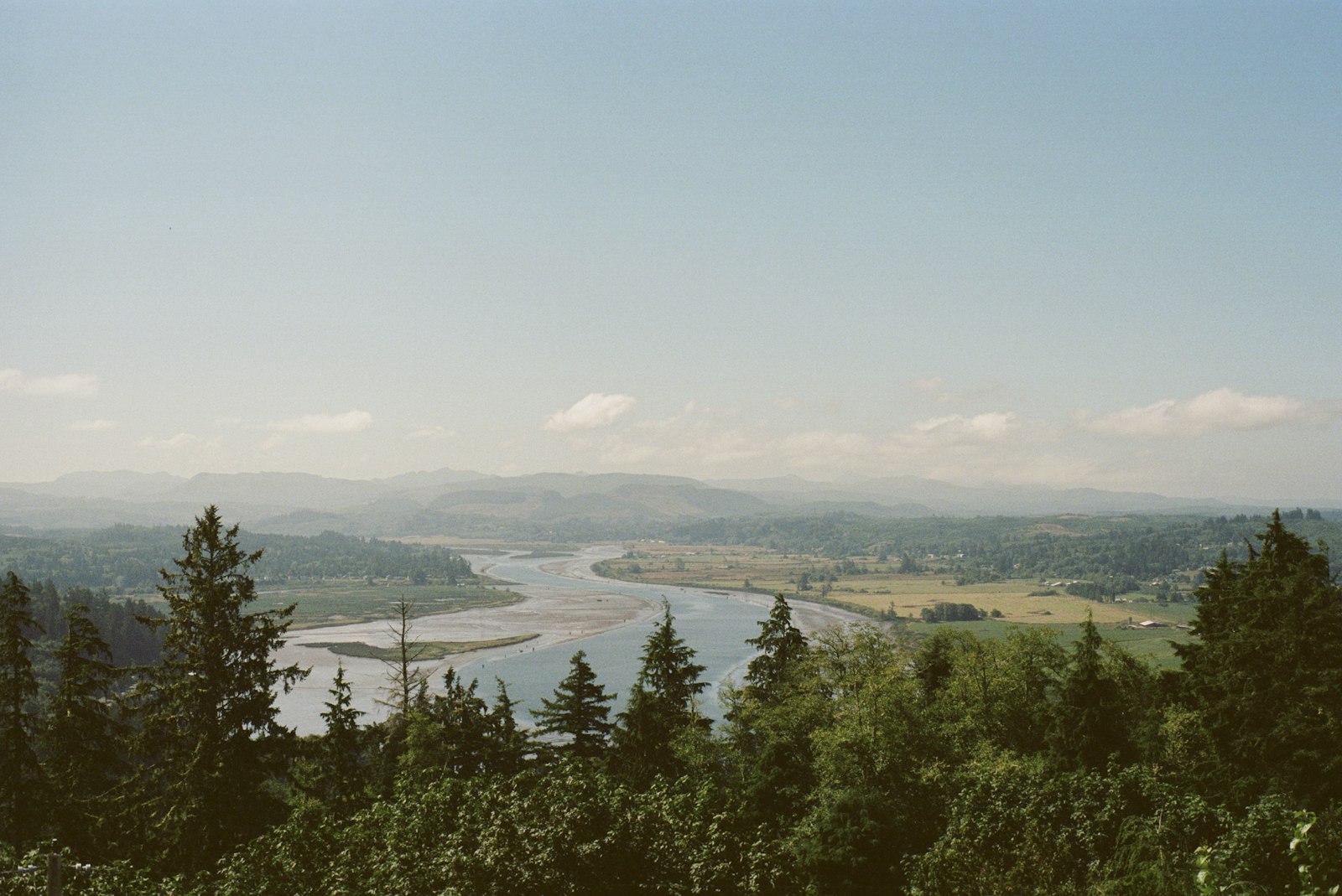 Forested hills above a wide river valley