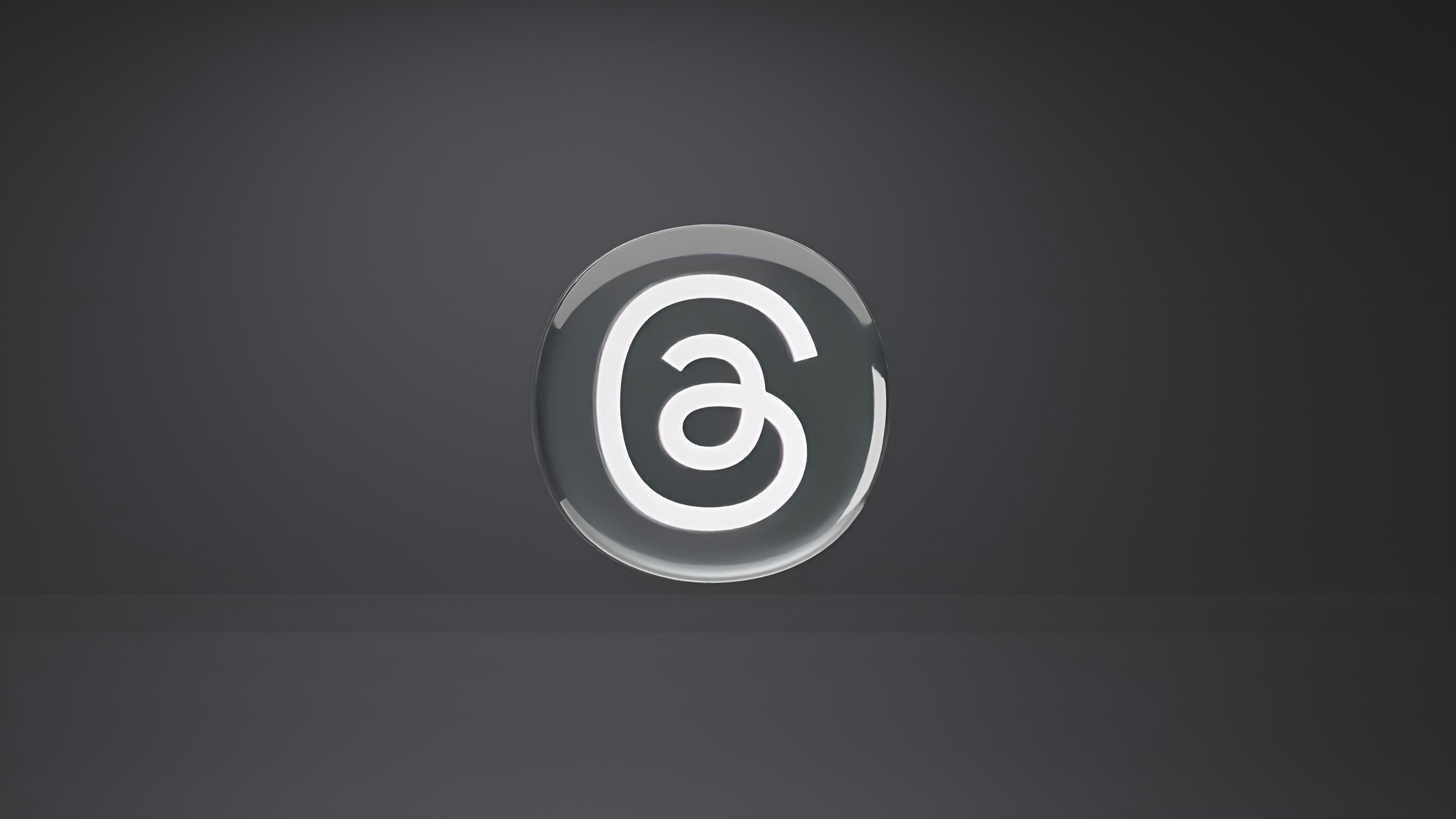 a white and black logo on a black background