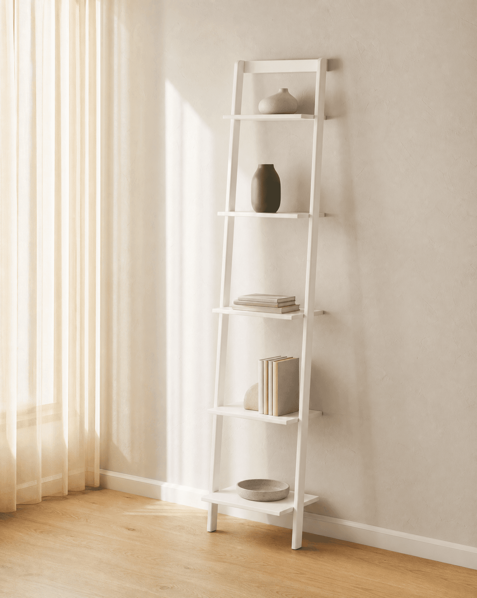 White AllModern Joe ladder bookcase styled in a bright living room