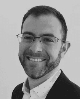 A professional headshot of a man