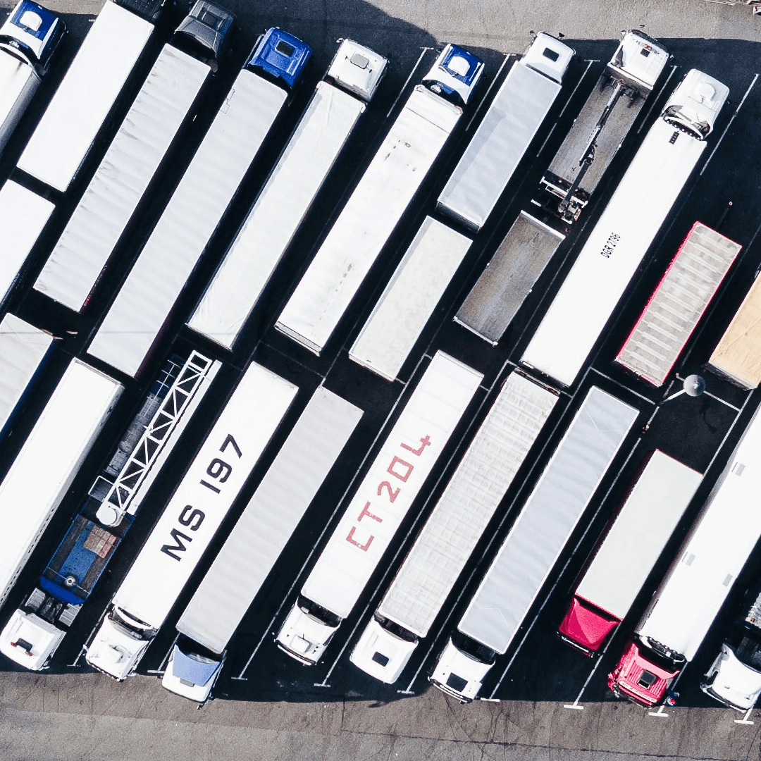 Aerial view of trailers staged in logistics yard monitored by yard management system