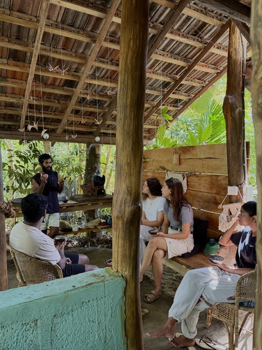 a group of women standing on top of a sandy beach