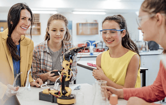 High school girl working on a science research project with a mentor in a laboratory setting