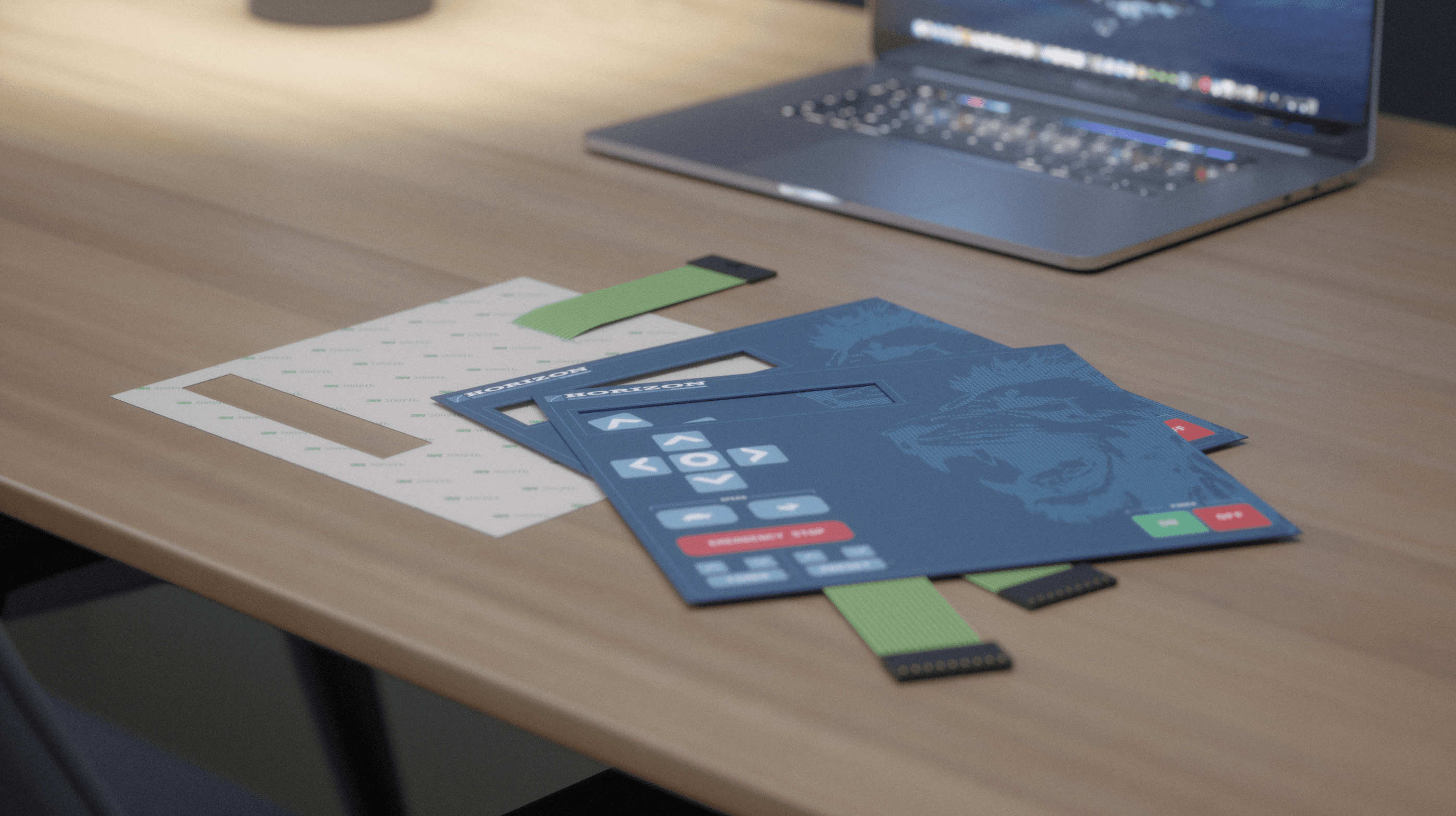 Several membrane panels arranged on a table, highlighting their sleek and durable design