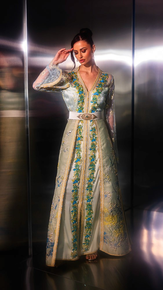 Beige and gold Moroccan caftan with blue embroidery, handcrafted couture piece designed for luxury occasions in Bahrain