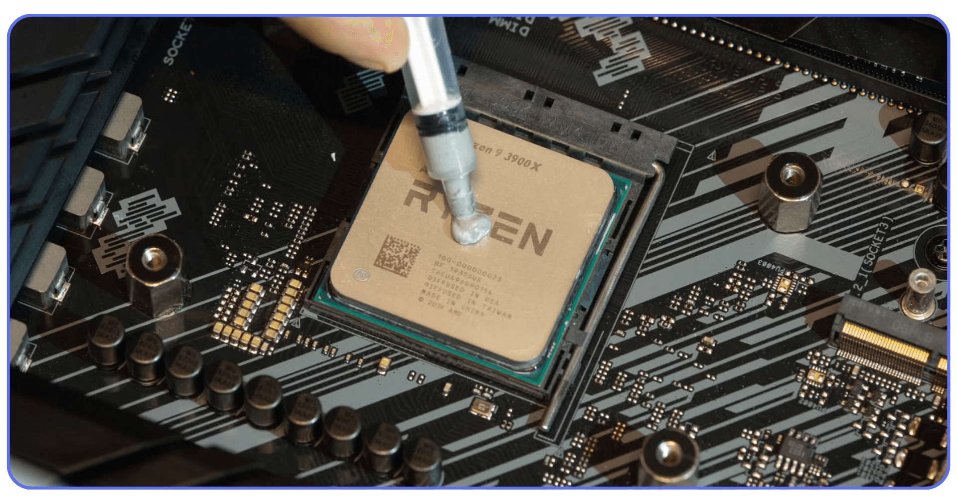 Applying thermal paste to an AMD Ryzen CPU installed on a motherboard to improve cooling and prevent thermal throttling.