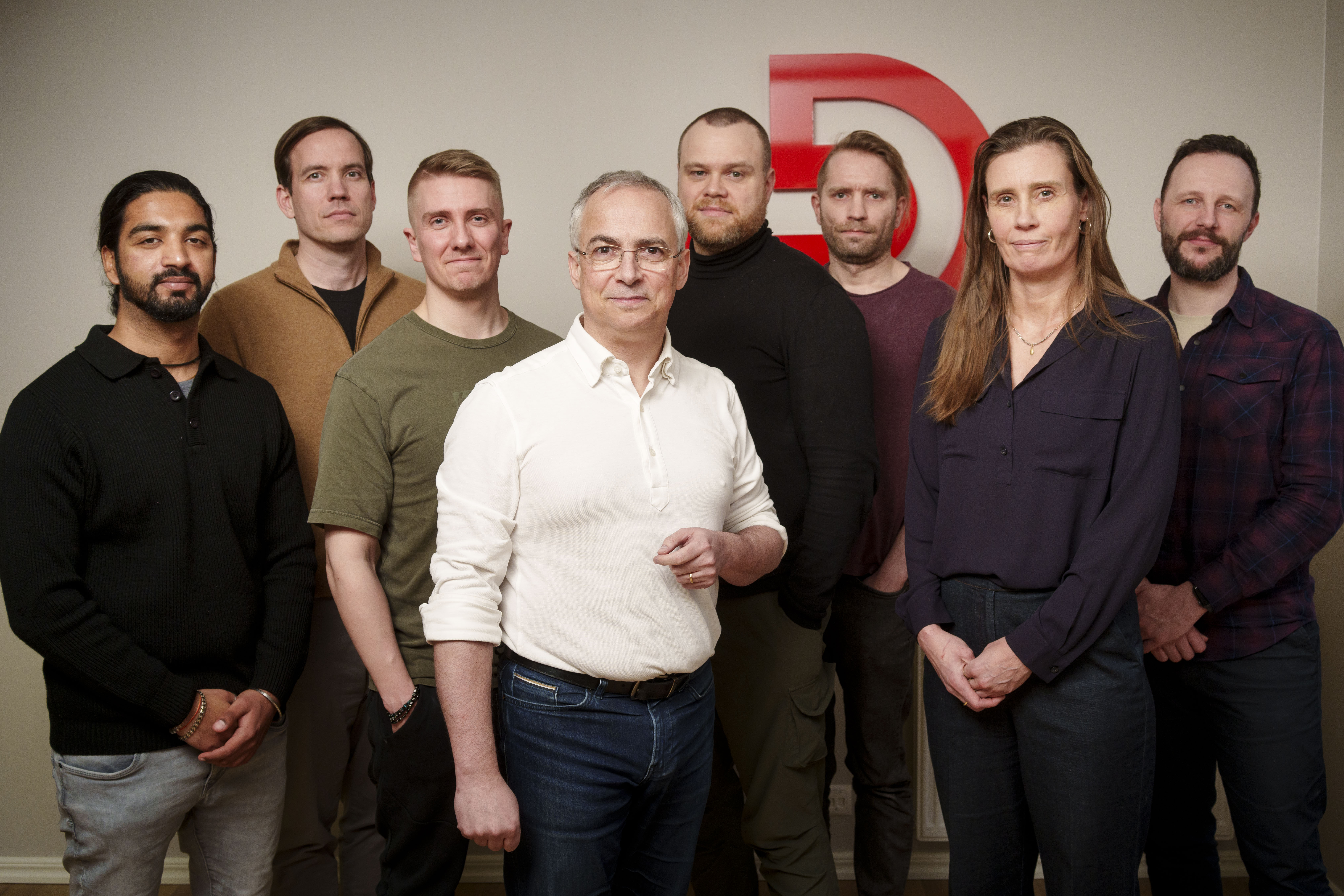 Stefán Baxter with a group of employees of the company. Dr. Óli Páll stands to the left of Stefán in a green shirt.