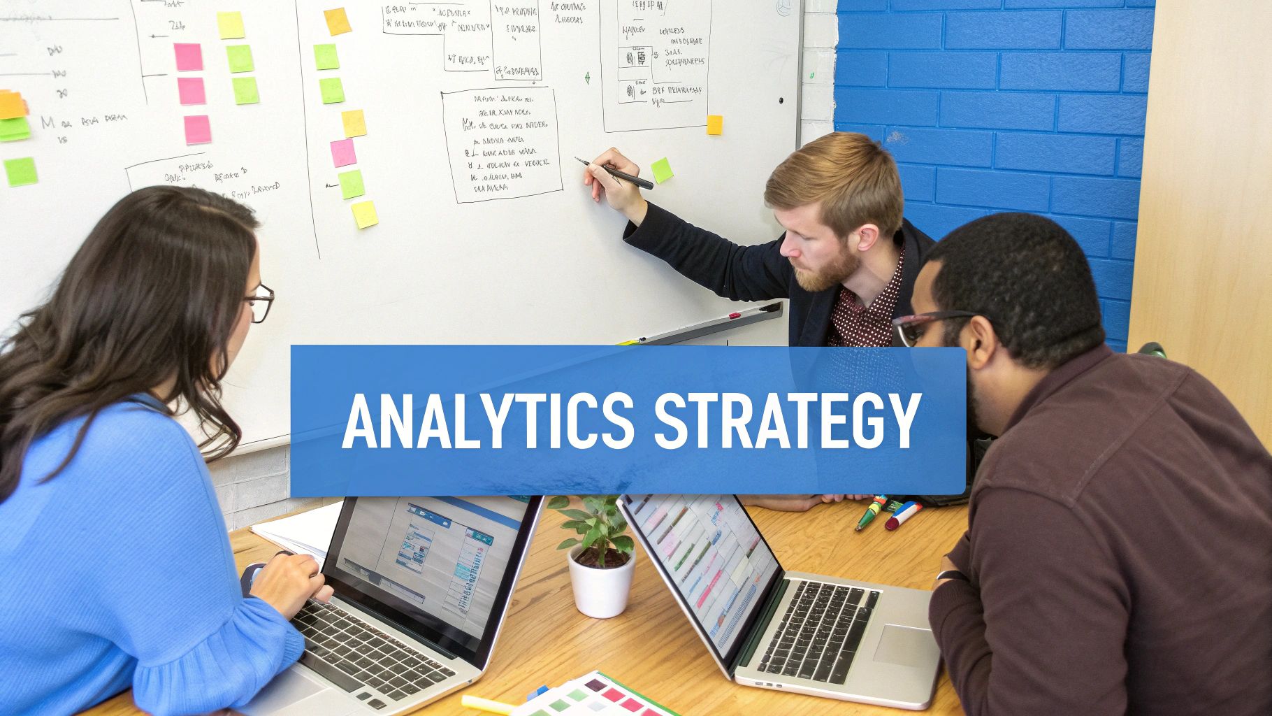 A team of professionals collaborating around a screen showing data visualizations