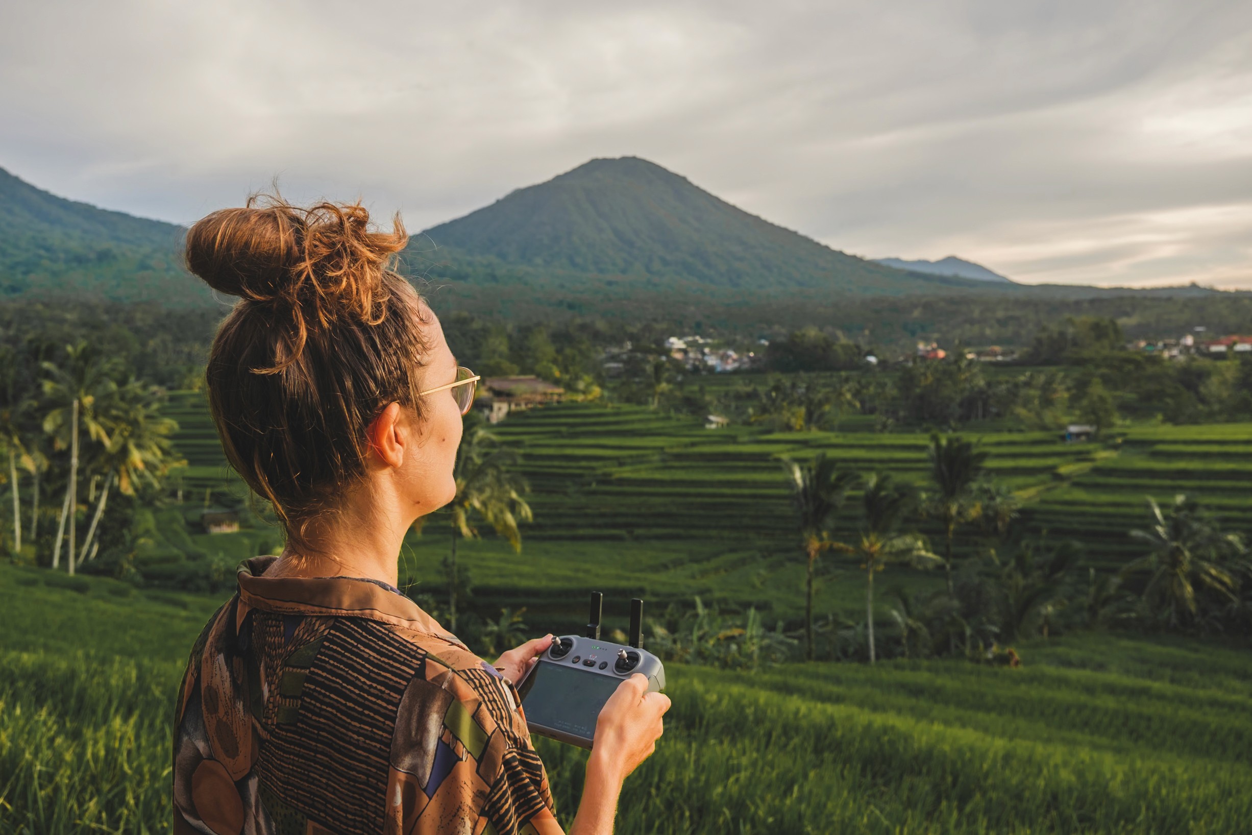 eva overlooking a lush tropical landscape during a mindful travel experience.