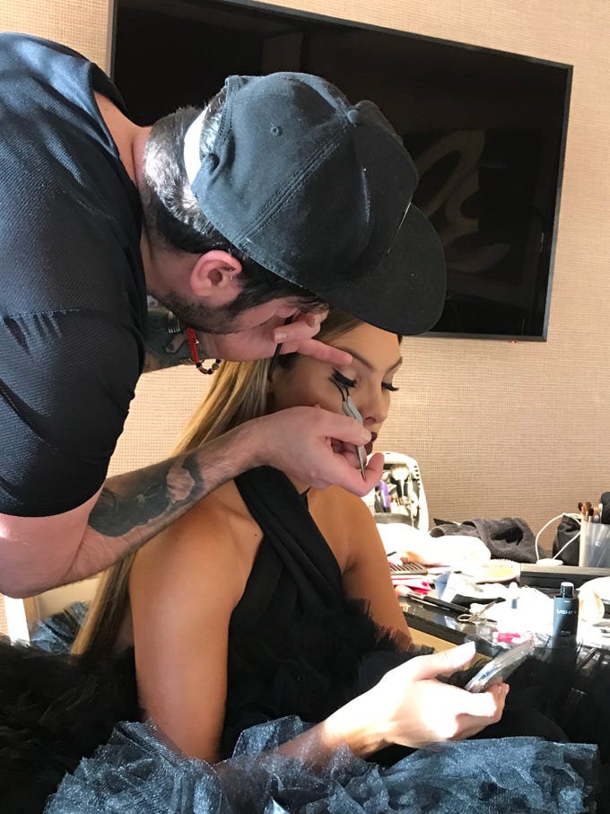 José Figueroa applying Lashify lashes on Lele Pons for a red carpet appearance. Behind-the-scenes moment of celebrity glam in action.