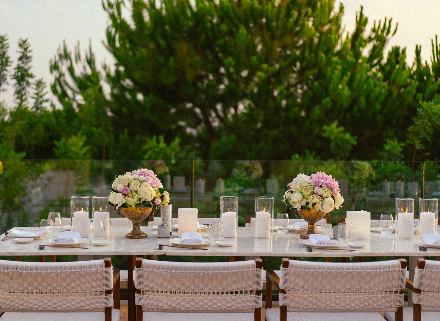Luxury outdoor wedding reception table decor with bespoke pink and white floral centerpieces in Peloponnese Greece