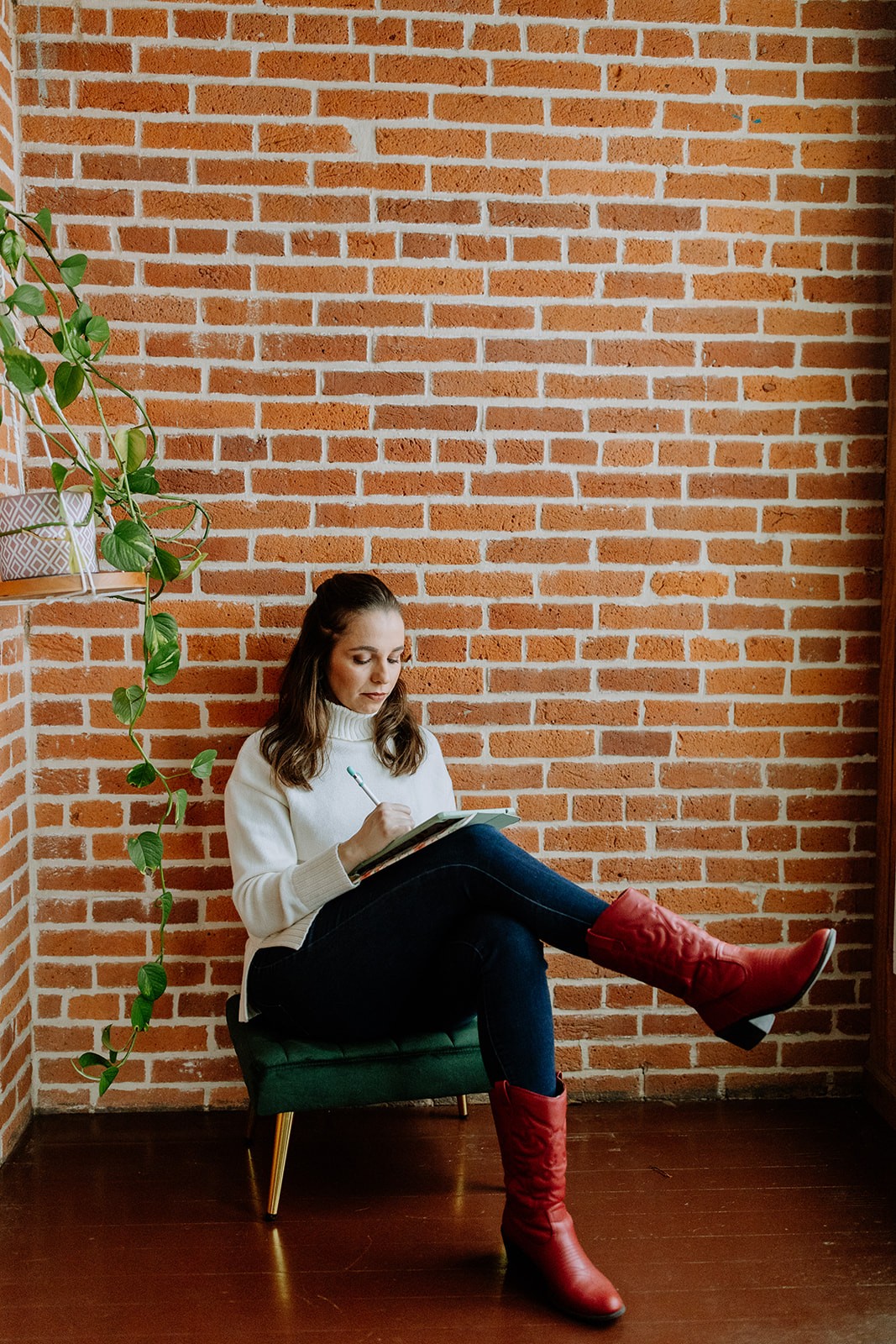 Founder and Designer Jamille Ramos working on her ipad.