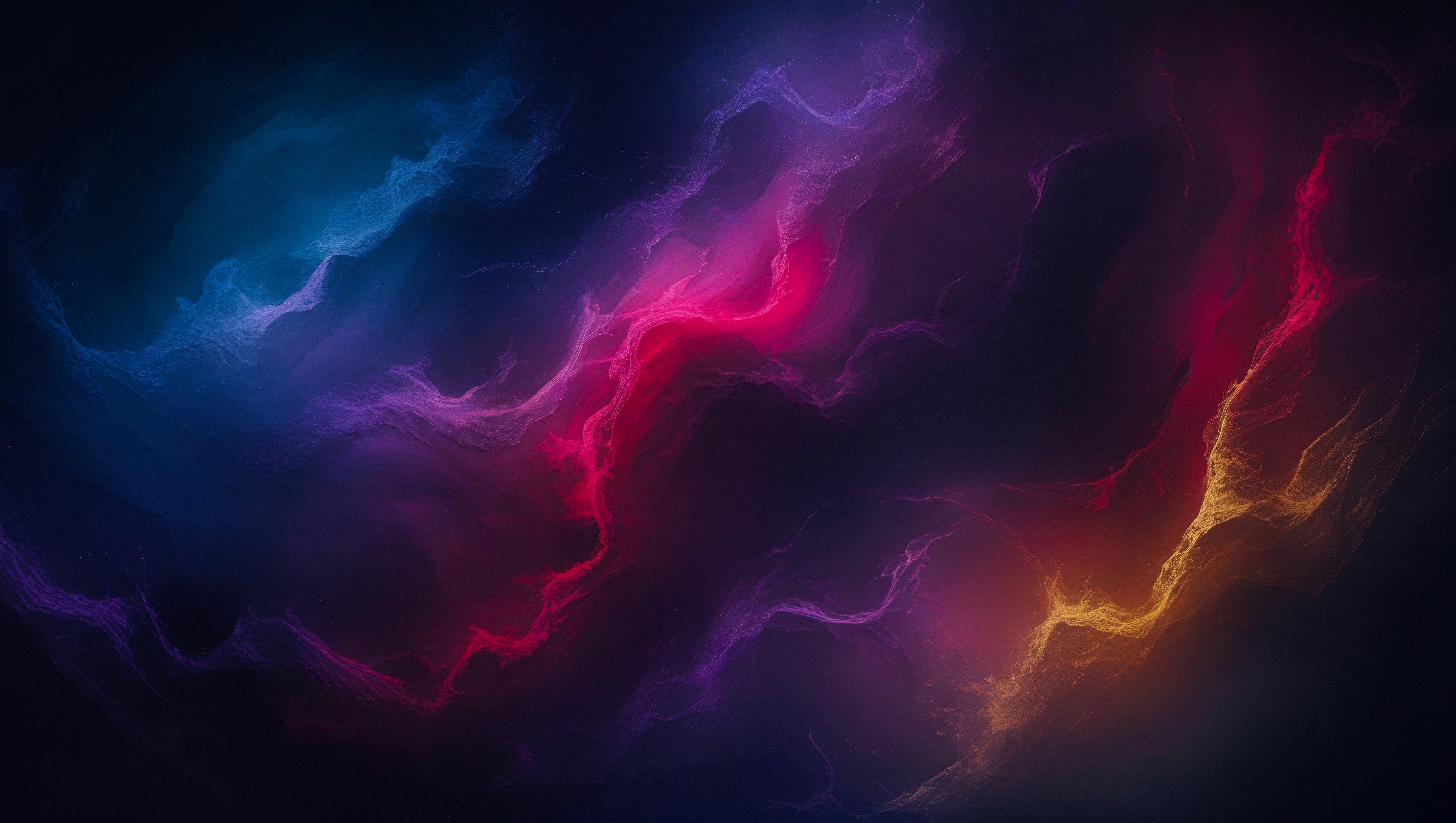 Man sitting in a dimly lit room, wearing a beige shirt and looking contemplative.