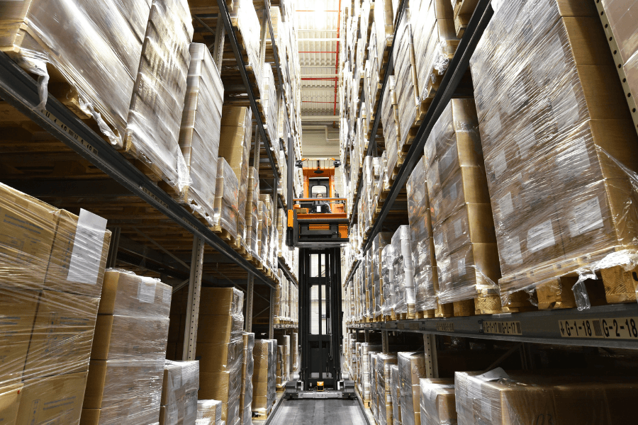Interior view of a high-rack warehouse facility with organized inventory.