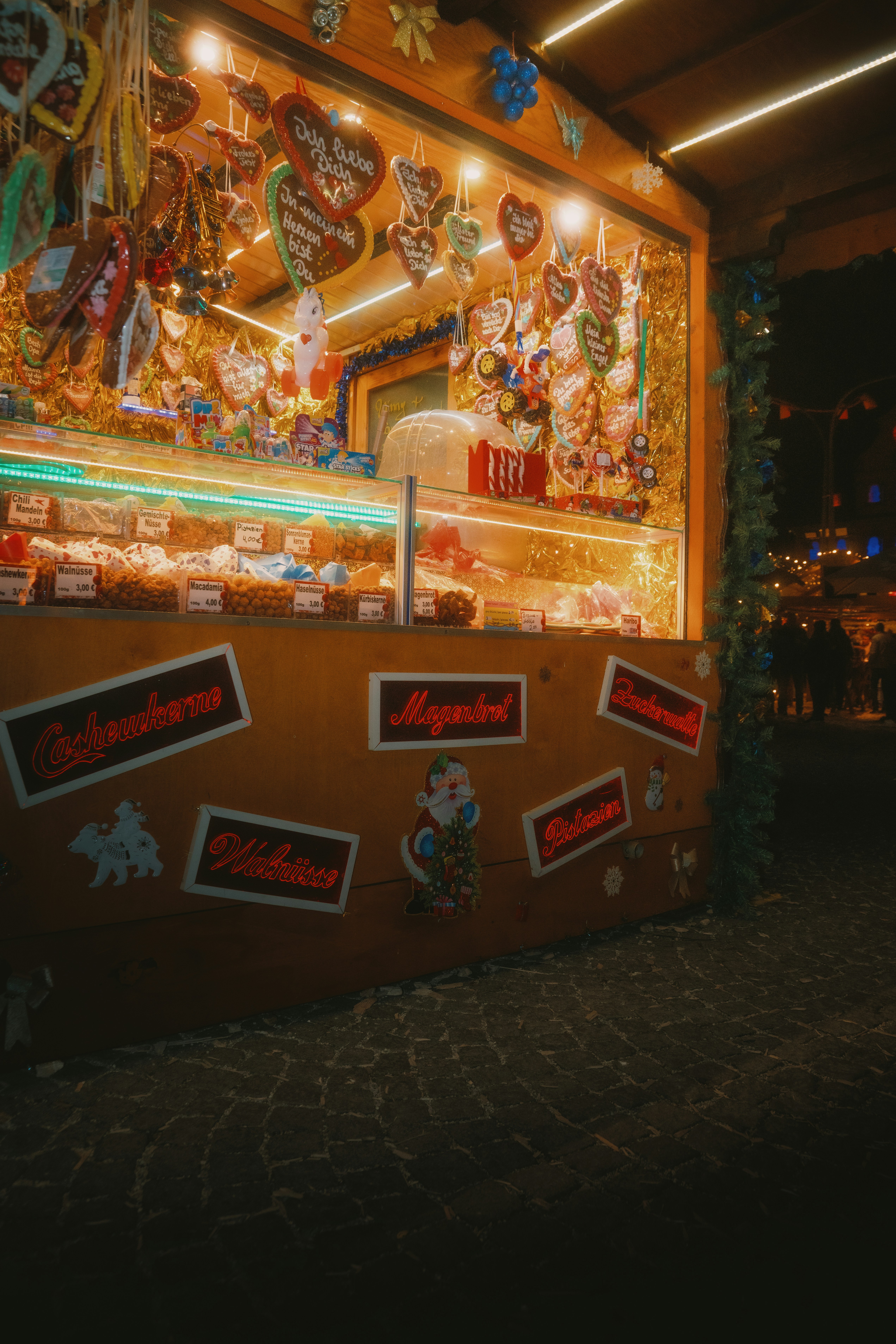 Christmas market stall with gingerbread hearts and sweets