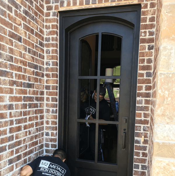 Traditional wrought iron double doors by M2 Metals Iron Doors DFW