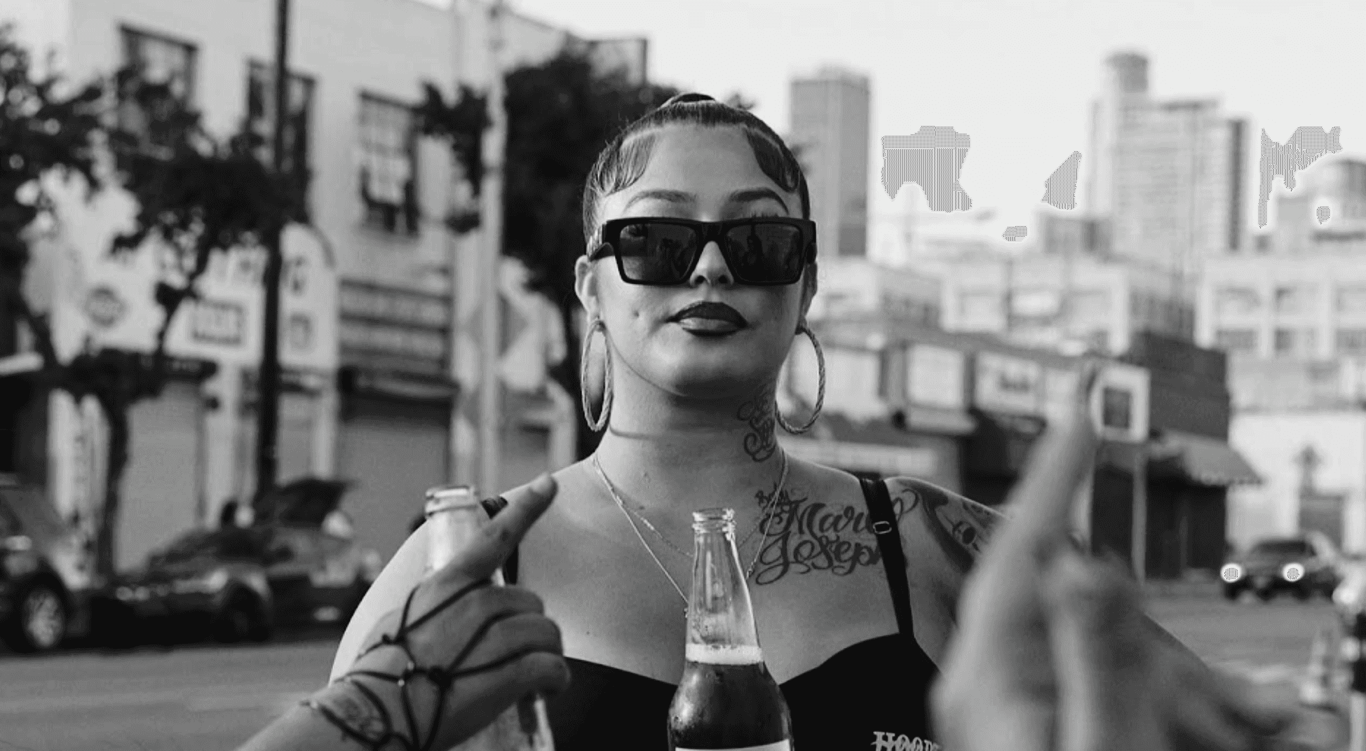 LOVECHILD Culture Club Movement, Women drinking a cold beer from a bottle on the street