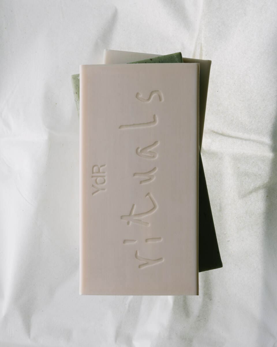 Photo of soap bars with the Rituals logo stamped on them.