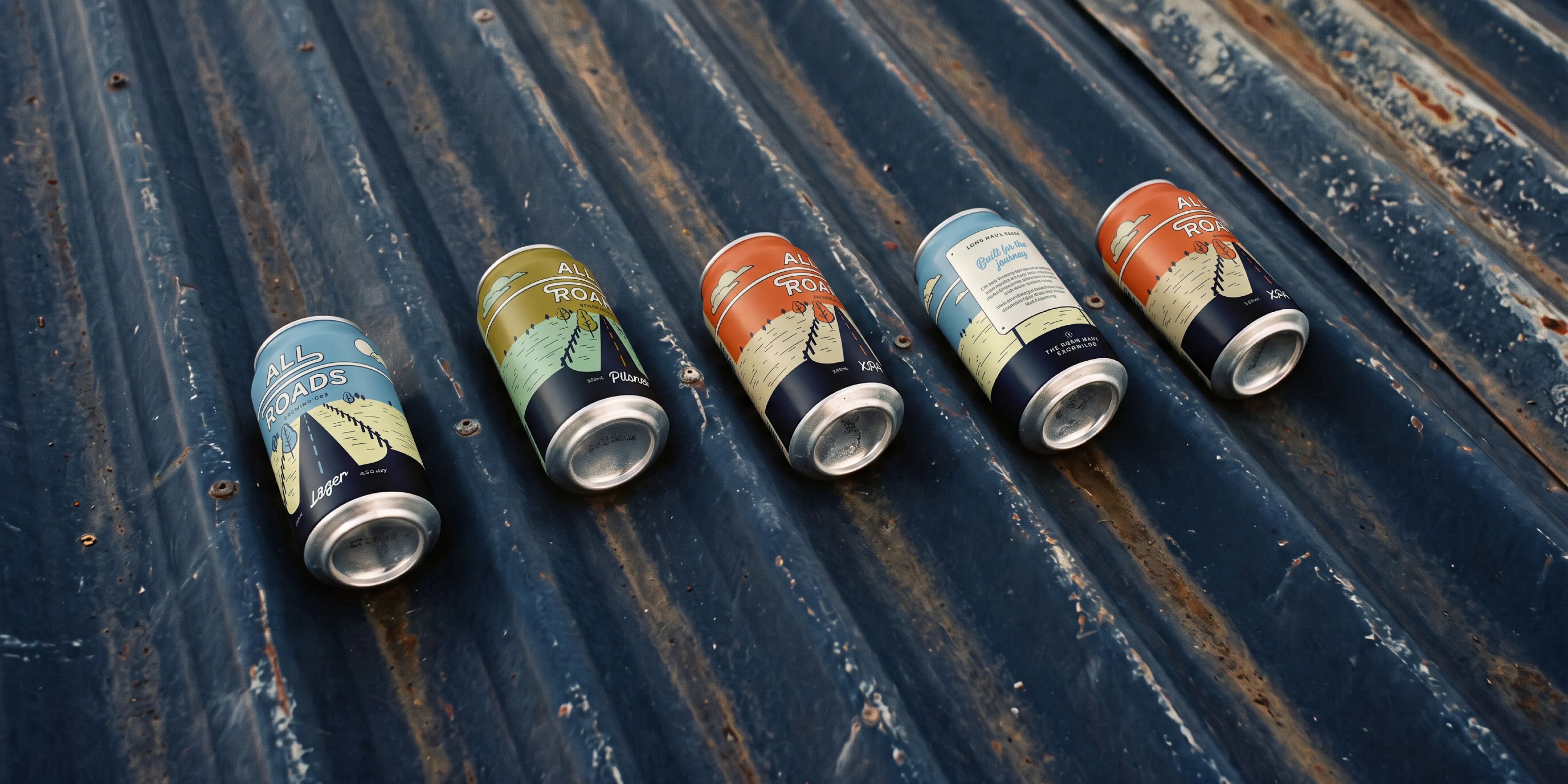 All Roads Brewing Co. full can lineup on a rusted corrugated iron surface