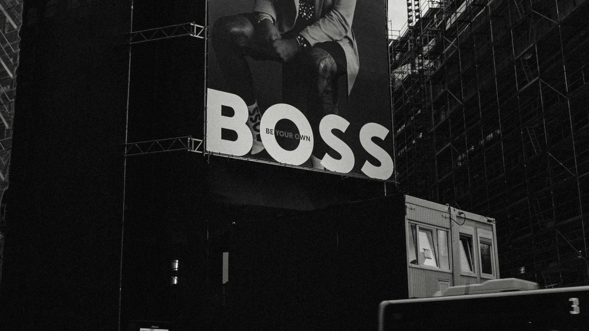 a billboard on the side of a building under construction