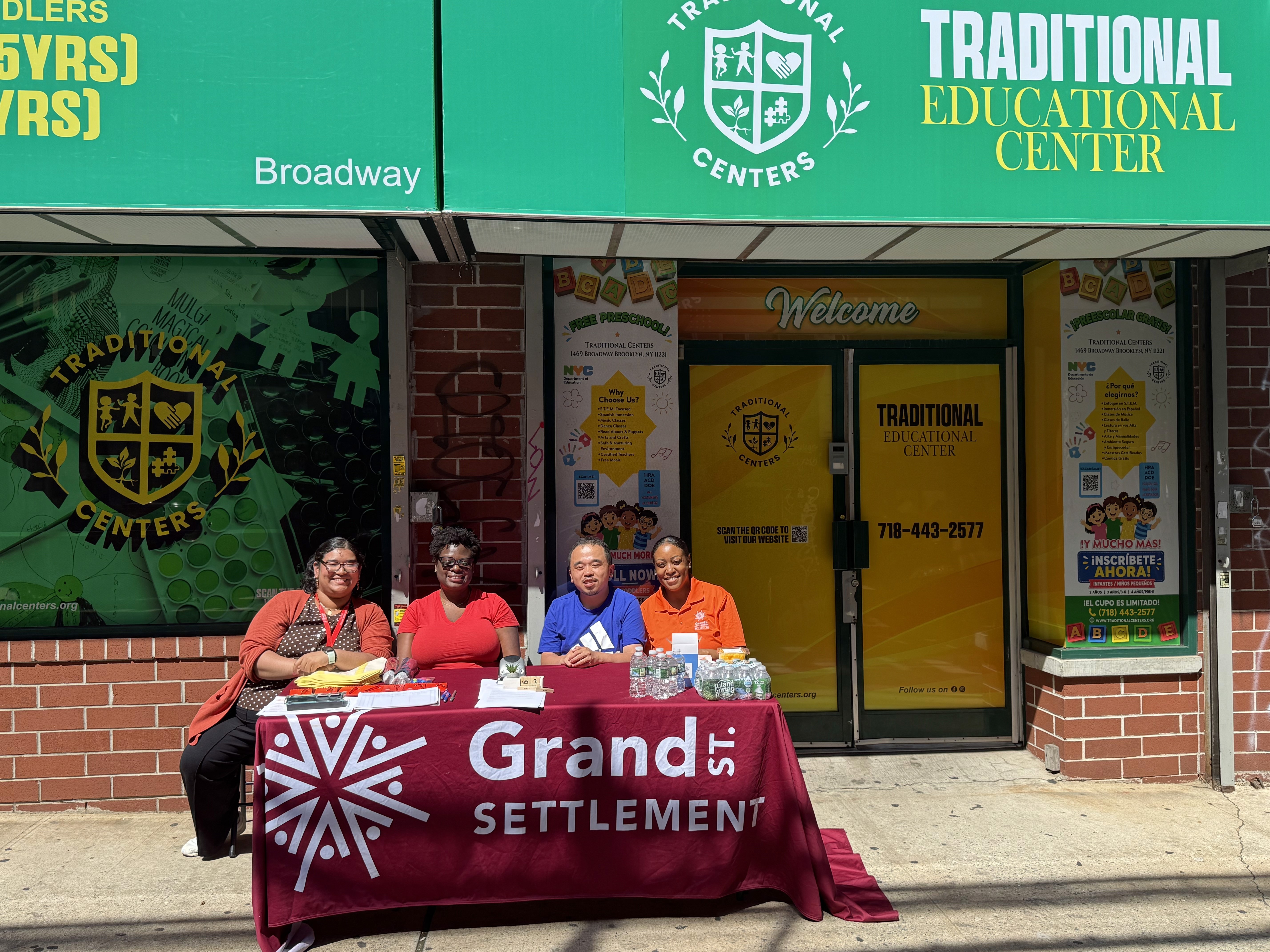 Staff table in front of a Traditional Educational Center.