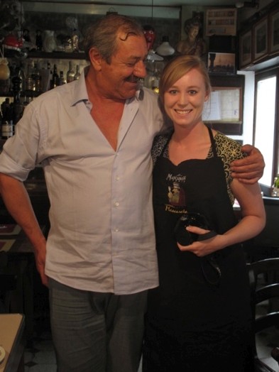 A photo of two people in a bar.