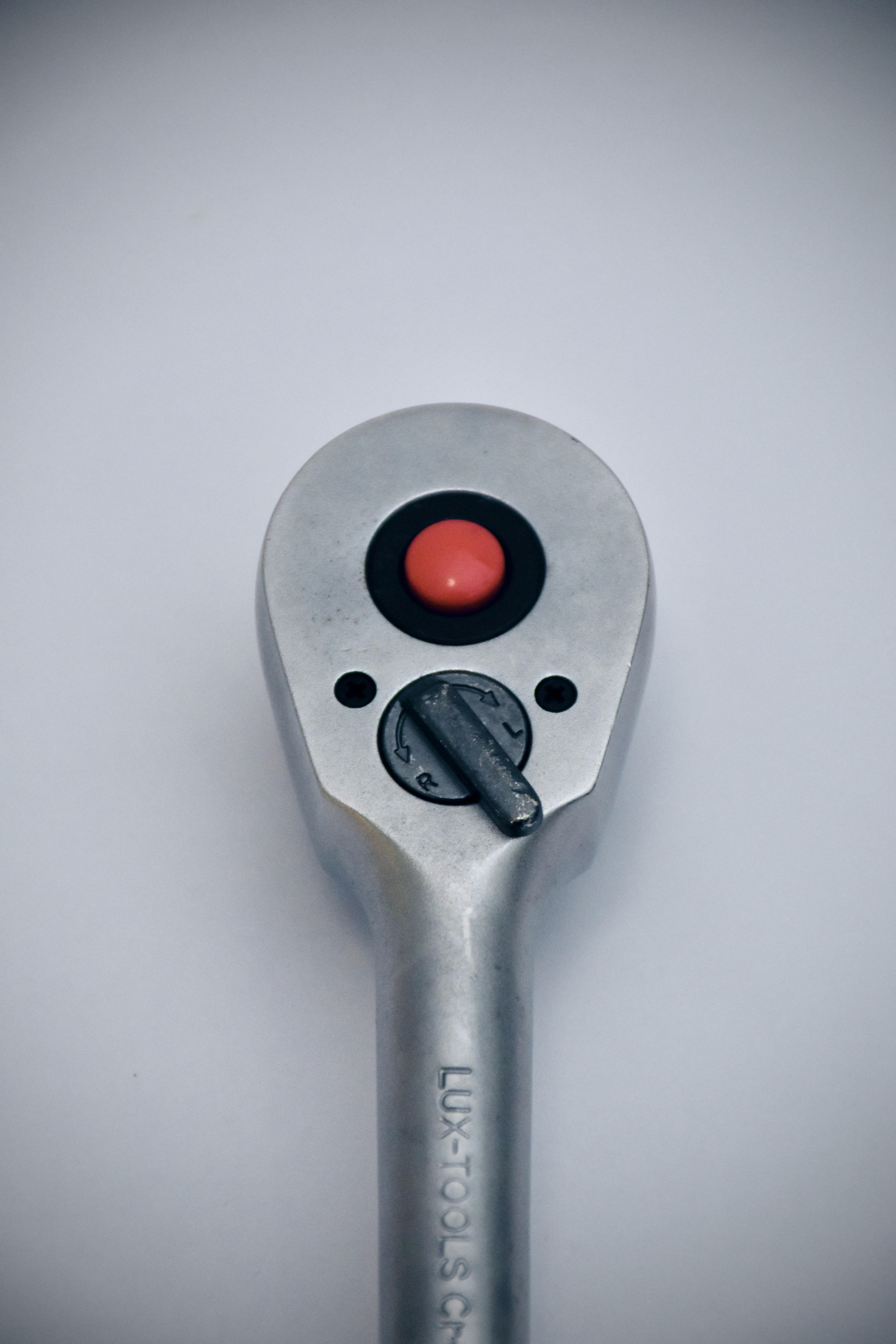 grey and red metal tool