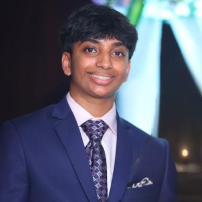 Black and white portrait of a man with a beard and glasses