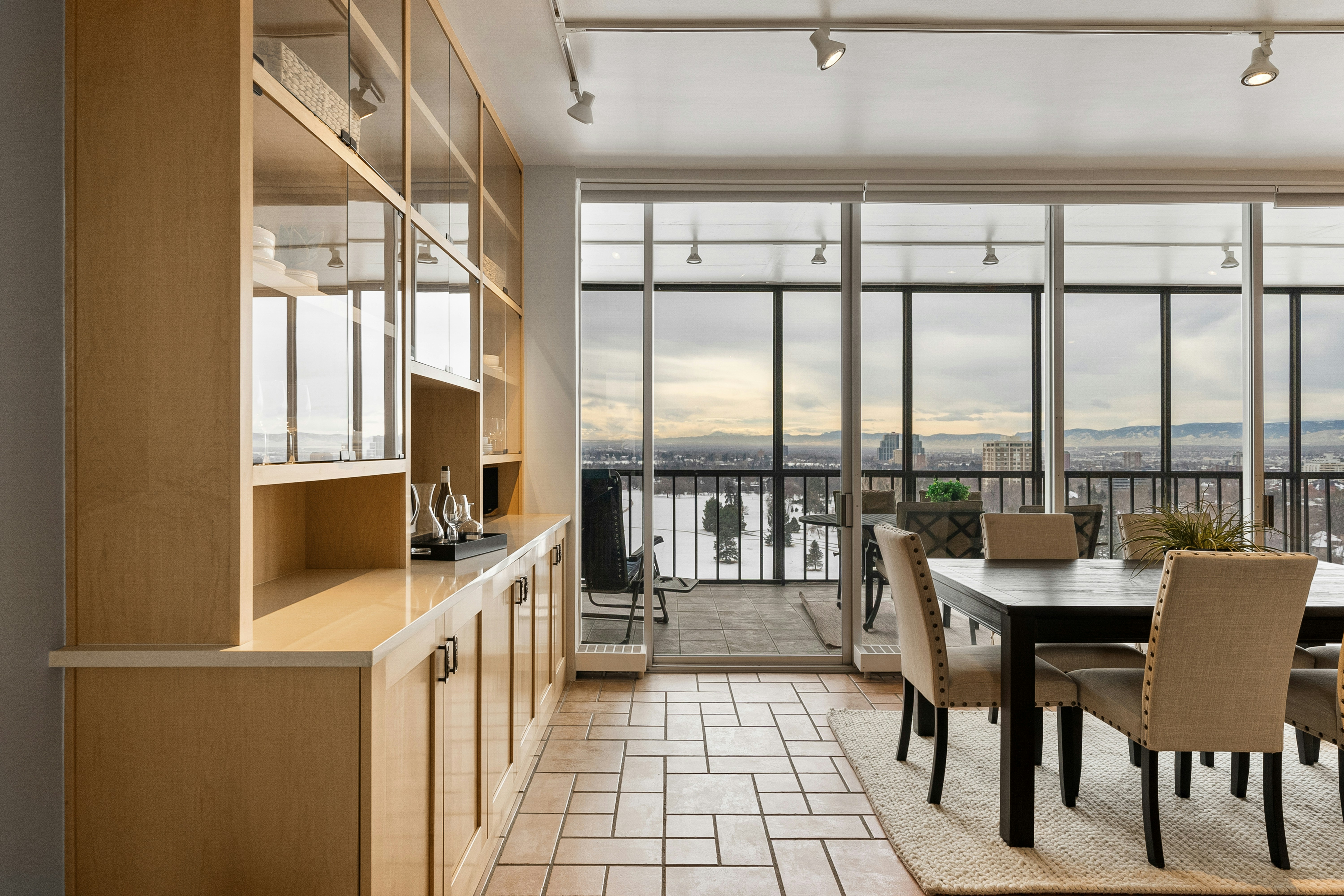 A dining room with a table and chairs