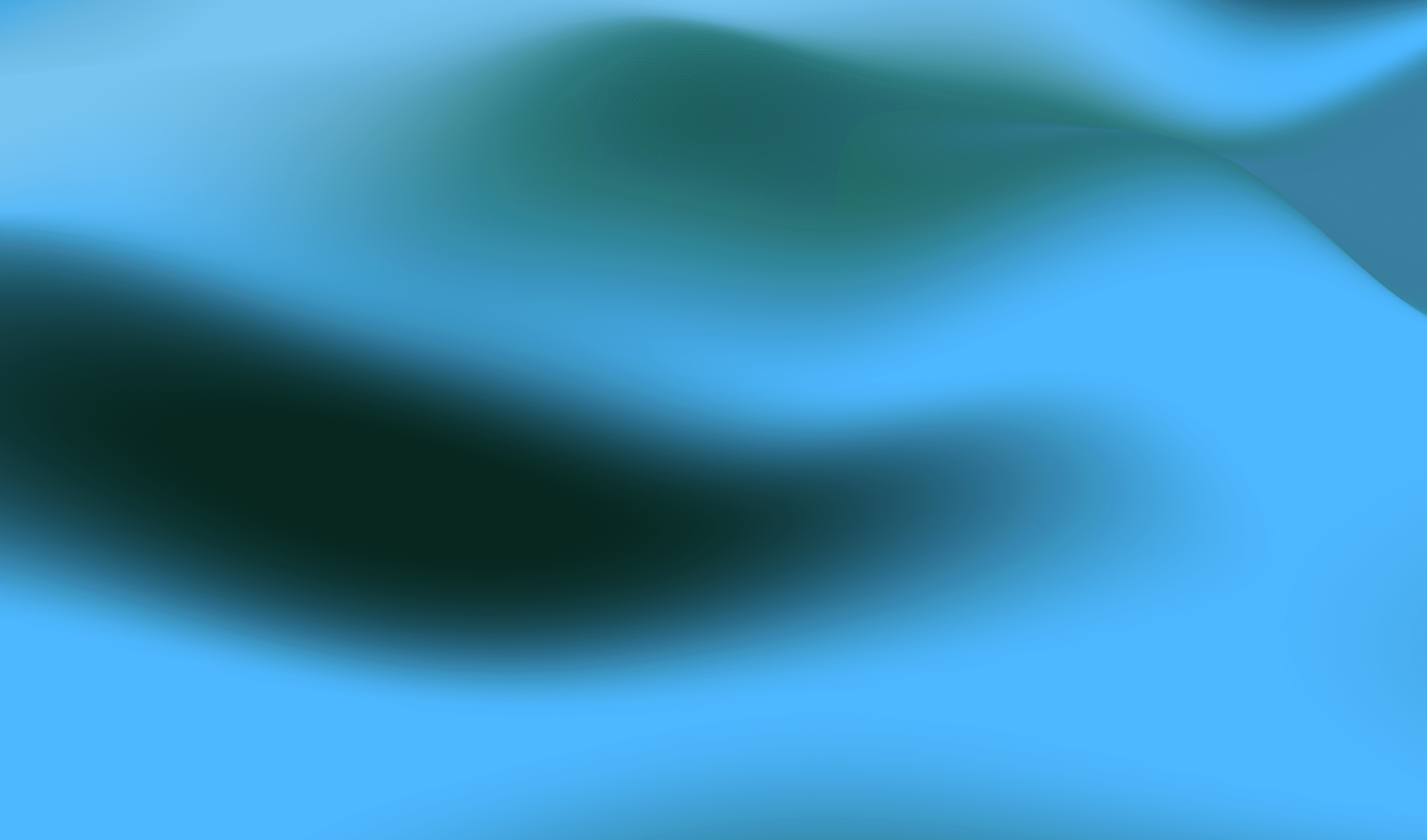 Creative workspace with large windows and a wall full of inspiration boards.