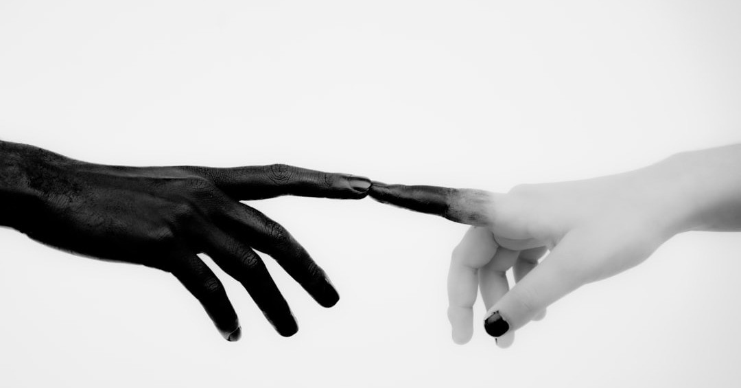 persons hand with white manicure