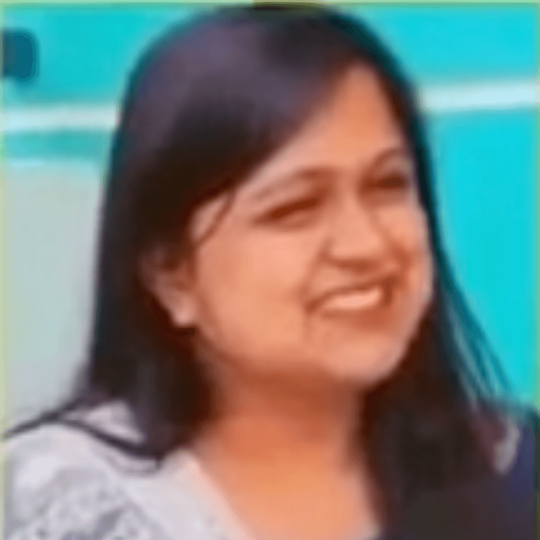 a person sitting at a table looking at the phone